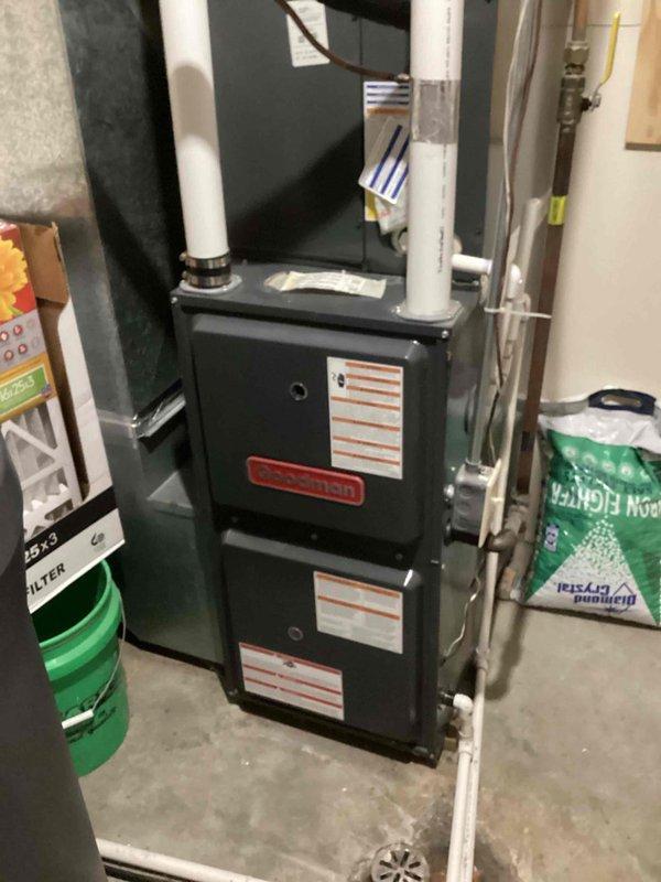 Responded to service call for a non-functioning Goodman furnace. Diagnosed issue with faulty door switch causing system failure; when blower cabinet door was removed, furnace resumed operation. Temporarily bypassed door safety switch to restore heating function and documented evidence of electrical arcing within switch. Initiated parts order for replacement door switch.