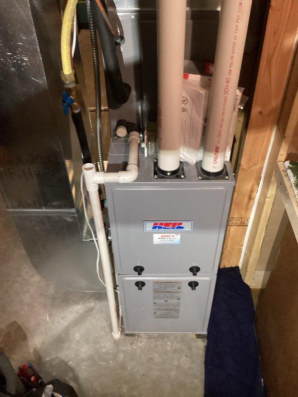 Performed HVAC repair service on Heil furnace system, replacing a faulty condensate trap with a new collector box. Completed installation without safety switch as specified, resolving the leaking issue. System operation verified and confirmed proper functionality.