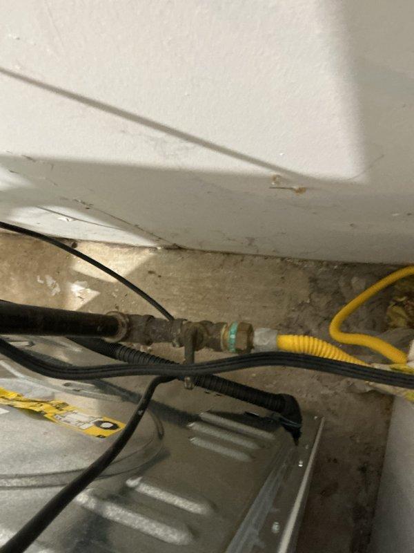 Responded to reported gas leak at dryer connection. Conducted thorough inspection of gas fitting using bubble test method and detected no leaks. Verified findings with tenant who confirmed absence of gas odor in the area. Visual inspection of connection hardware showed proper installation with no signs of compromise.