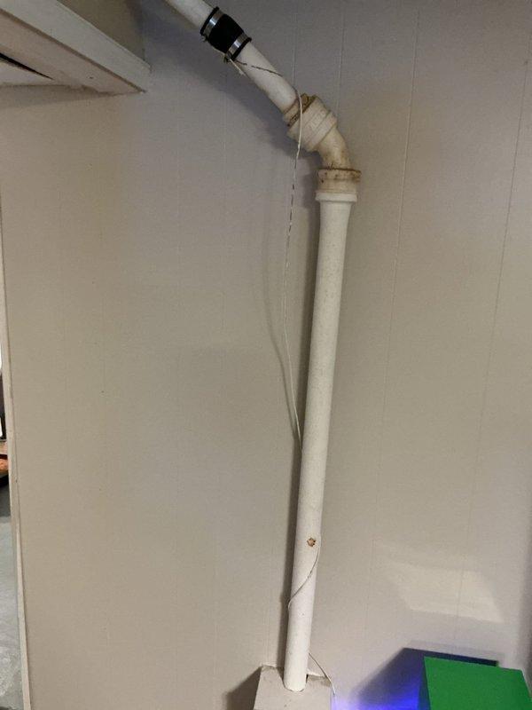 Replaced deteriorating 2-inch galvanized kitchen sink drain line that showed signs of pinhole leaks with new PVC piping. Also inspected dishwasher drain pipe which contained debris buildup, potentially indicating pipe wall thinning, though no active leak was present at time of service.