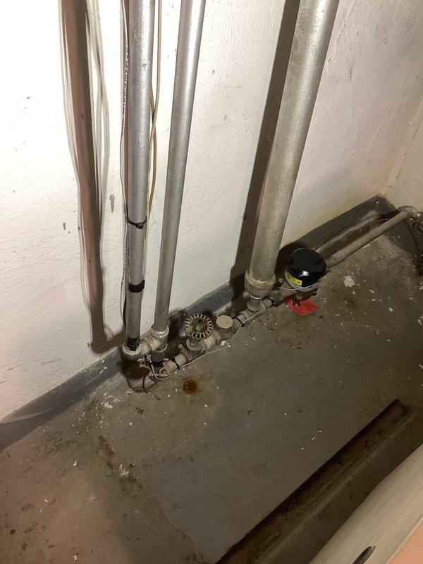 Performed annual boiler tune-up maintenance per agreement. Found system operating with excessive aquastat temperature (210°) causing water to boil and create air in system, and gas pressure set above 4.00. Corrected issues by adjusting aquastat to 180°, reducing gas pressure to 3.48, purging air from radiators, and setting water pressure to 18 psi. Cleaned burners and burner area, adjusted fresh air intake piping for improved operation, and verified system returned to normal operation.