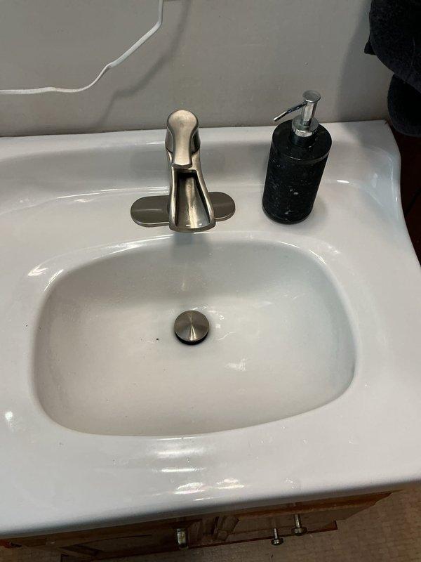 Responded to a service call for a slow draining bathroom sink. Inspection revealed significant biofilm accumulation causing the drainage issue. Successfully cleared the clog by augering the bathroom sink drain, restoring proper drainage functionality.