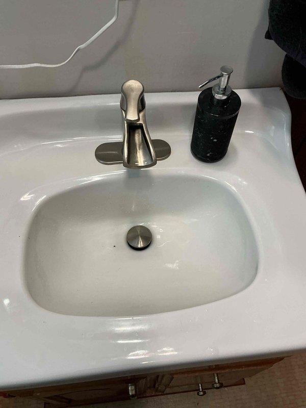 Responded to a service call for a slow draining bathroom sink. Inspection revealed significant biofilm accumulation causing the drainage issue. Successfully cleared the clog by augering the bathroom sink drain, restoring proper drainage functionality.