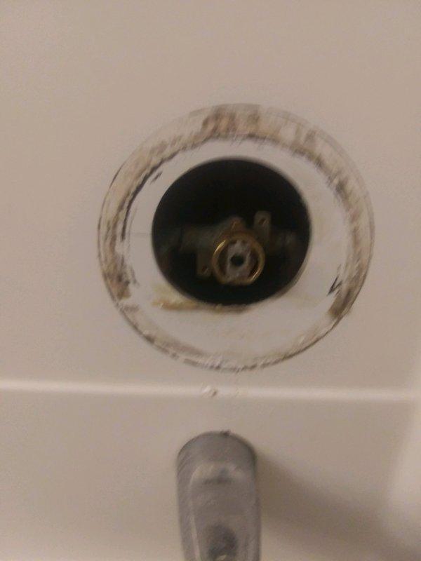 Responded to a service call for a shower faucet with a broken Moen cartridge that had snapped off inside the valve body. Upon inspection, found significant mineral buildup around the valve opening and drain area. Successfully extracted the damaged cartridge remnants and installed a new replacement Moen cartridge, restoring proper functionality to the shower faucet handle and water control.
