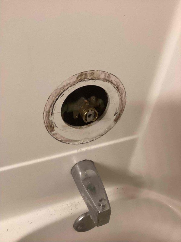 Responded to a service call for a shower faucet with a broken Moen cartridge that had snapped off inside the valve body. Upon inspection, found significant mineral buildup around the valve opening and drain area. Successfully extracted the damaged cartridge remnants and installed a new replacement Moen cartridge, restoring proper functionality to the shower faucet handle and water control.