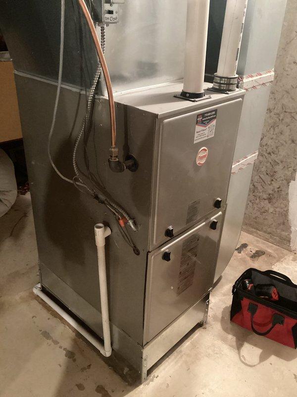 Performed comprehensive furnace tune-up on FRP unit of indeterminate age. Inspected and verified all components including clean filter, properly functioning blower, and electrical components within specifications. Cleaned condensate trap, confirmed clear drainage lines, inspected heat exchanger integrity, verified proper gas pressures, and examined venting system. System operated correctly during extended testing period. Noted basement leak and aging water heater to customer.