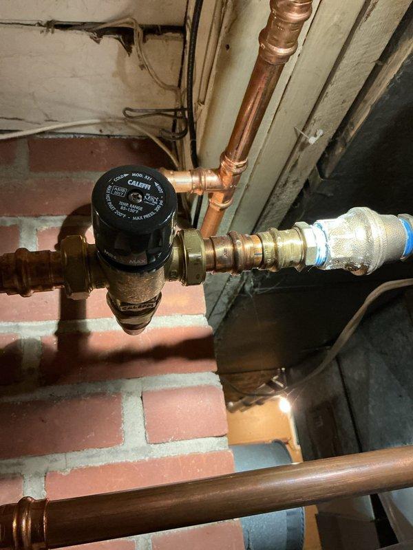 Diagnosed complete failure of electric water heater with melted bottom element and electrical components. Removed damaged 50-gallon unit and installed new replacement water heater. Verified proper operation and restored hot water service to the residence.