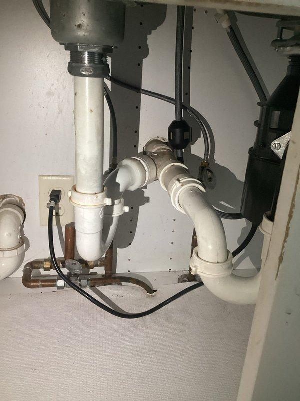 Successfully installed a new Moen kitchen faucet with single-handle control and pull-down sprayer on a circular base plate, replacing customer's previous single-hole model. Additionally, installed customer-supplied toilet seat and addressed shower issues by removing a problematic handheld T-connector that was causing noise and restricted water flow, then reinstalled the showerhead to restore proper function.