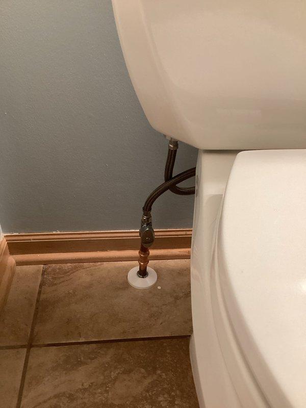 Responded to service call for water leak at toilet connection. Diagnosed leak at shutoff valve connection to supply line. Replaced faulty valve and installed new supply line, successfully resolving the leak issue.