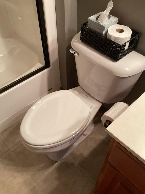 Provided estimate for replacing existing standard toilet with new comfort height elongated ADA-compliant model in first floor bathroom. Inspected current installation and surrounding area to ensure proper specifications for replacement. Photos documented the existing toilet and bathroom configuration for accurate quote preparation.