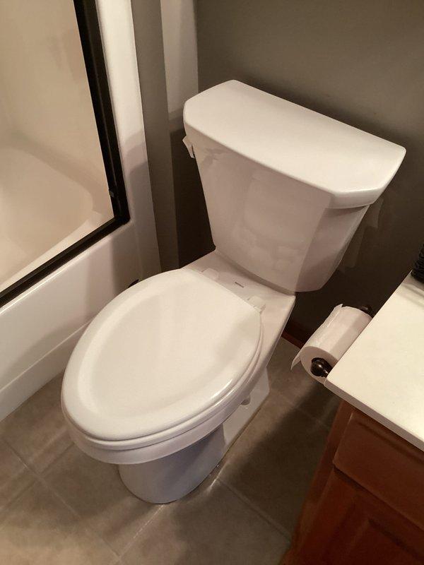 Provided estimate for replacing existing standard toilet with new comfort height elongated ADA-compliant model in first floor bathroom. Inspected current installation and surrounding area to ensure proper specifications for replacement. Photos documented the existing toilet and bathroom configuration for accurate quote preparation.