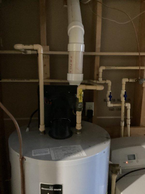 Diagnosed 27-year-old LP PV water heater producing only lukewarm water. Inspection revealed failing heating elements and control system with significant sediment buildup. Provided customer with replacement options for this aging Bradford White unit, noting that repair would not be cost-effective given the unit's advanced age and deteriorated internal components.