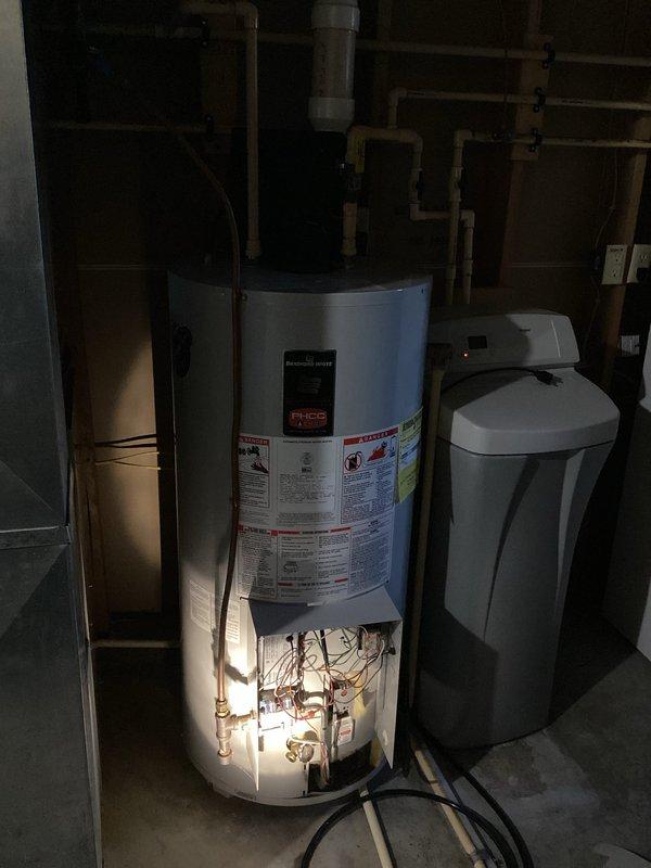 Diagnosed 27-year-old LP PV water heater producing only lukewarm water. Inspection revealed failing heating elements and control system with significant sediment buildup. Provided customer with replacement options for this aging Bradford White unit, noting that repair would not be cost-effective given the unit's advanced age and deteriorated internal components.