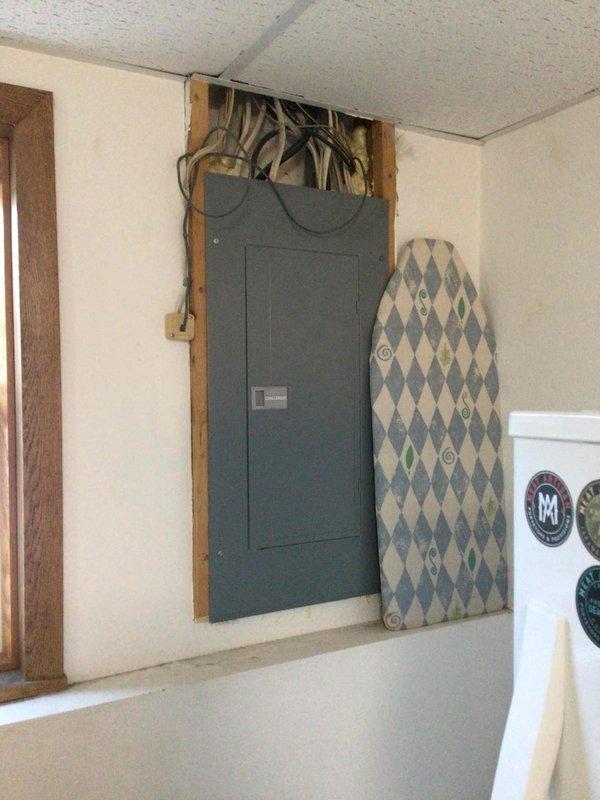 Responded to warranty service call for blower control issues. Installed blower wheel but noted continued balance problems; submitted parts order for new motor mount and squirrel cage. Documented equipment condition with photos of the electrical panel and HVAC system setup including furnace and water heater.