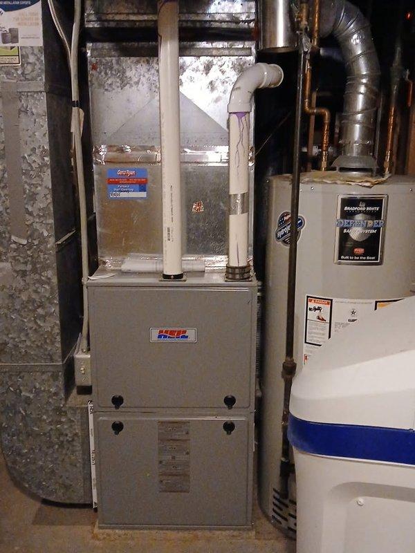 Performed routine maintenance on an 8-year-old Heil furnace system. Cleaned dirty flame sensor and identified concerning spots inside burner assembly. System is functioning properly after service; customer was informed about potential issues with the flame sensor that may require monitoring.