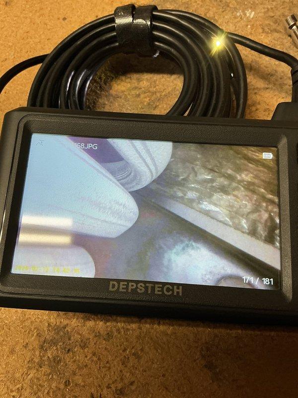 Diagnosed 23-year-old furnace with intermittent heating failure due to seizing blower motor. Replaced blower motor and wheel, performed cleaning to restore proper operation. Control board inspection revealed extensive dust accumulation and cobwebs, indicating lack of maintenance contributing to system issues.