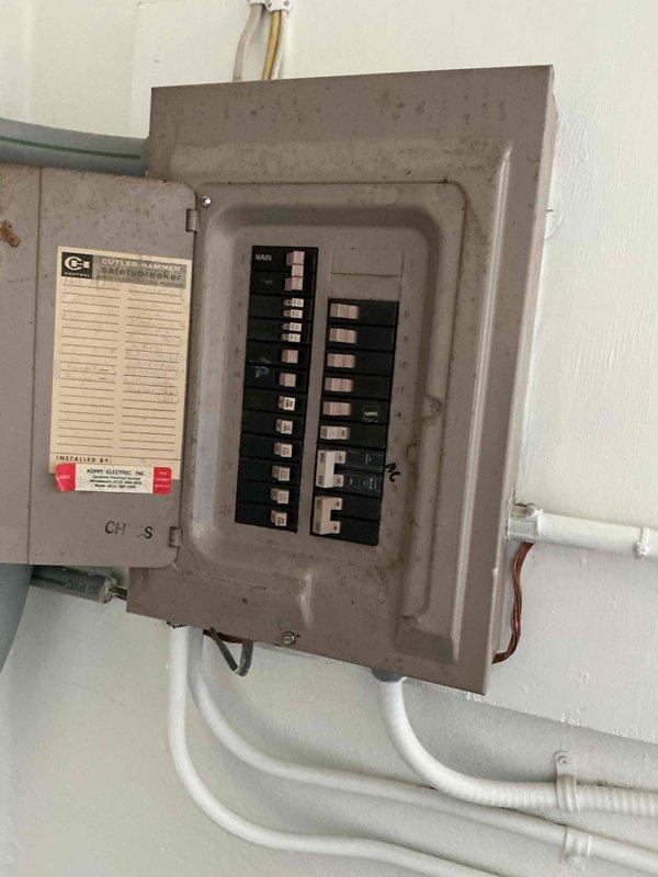 Responded to service call for recently installed heat pump not functioning properly during warm weather. Diagnostic inspection revealed system was operating in cooling mode rather than heating. Examined wiring connections and thermostat settings; determined thermostat is not properly recognizing heat pump. Documentation includes photos of water heater installation and electrical panel for reference.