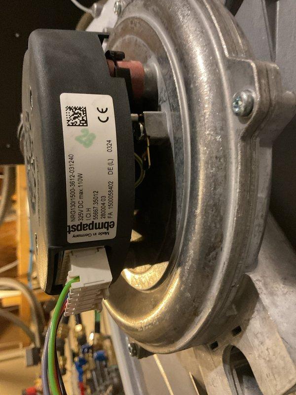 Responded to service call for tankless water heater throwing F008 error code (indicating incorrect fan speed). After consultation with IBC technical support, identified faulty fan assembly requiring replacement. Removed and inspected existing fan unit, noting wear on the aluminum housing and electrical connections. Fan replacement part has been ordered through parts department to resolve the ongoing system issues that have persisted since installation 9 months ago.