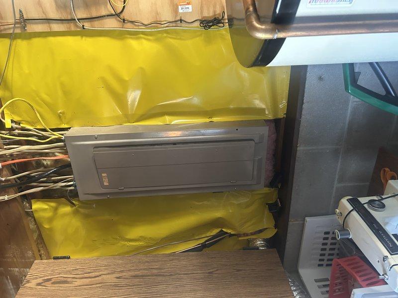 During follow-up service call, identified and repaired shorted low voltage wire in outdoor unit where insulation had worn through from contact with refrigerant line. System was found to be slightly overcharged; removed 1.0 lb of refrigerant, established proper charge levels, and verified proper operation through test run.