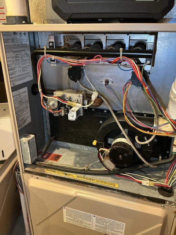 Responded to no-heat service call for 23-year-old furnace failing to maintain set temperature. Diagnosed multiple critical issues: control board malfunction preventing proper blower motor operation, high limit switch tripping causing lockout, and compromised secondary heat exchanger with visible rust-through causing exhaust leakage. Due to safety concerns and component failures, recommended complete furnace replacement. Scheduled same-day estimate for new system, including AC replacement options to address condensation issues.