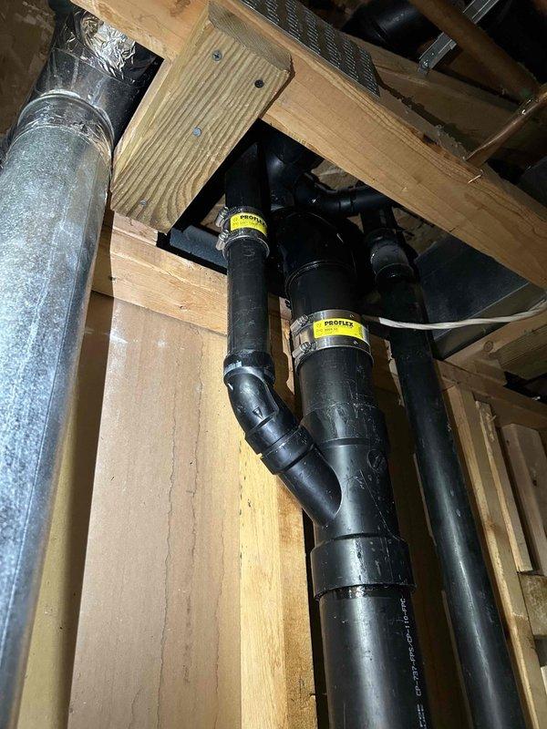 Repaired leaking ABS stack by replacing a faulty 45-degree fitting. Additionally, fixed a leaking toilet waste line by replacing the defective ABS joint. Installation verified and system now functioning properly with no leaks observed at connections.
