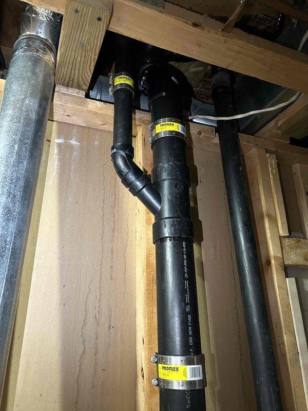 Repaired leaking ABS stack by replacing a faulty 45-degree fitting. Additionally, fixed a leaking toilet waste line by replacing the defective ABS joint. Installation verified and system now functioning properly with no leaks observed at connections.