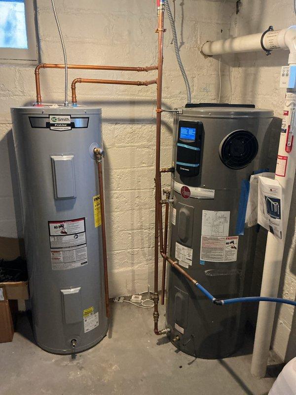 Responded to service call for A.O. Smith PROPH50 T2 RH350 DCB heat pump water heater that was beeping and displaying a high temperature code/compressor error. Diagnosed issue and resolved alarm by adjusting temperature setting to a lower level, which successfully cleared the fault code and restored normal operation.
