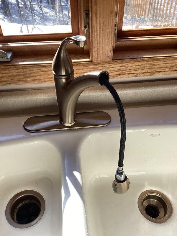 Conducted comprehensive assessment of kitchen faucet with leaking sprayer head, determining replacement necessary. Inspected refrigerator water line issue, noting absence of accessible shut-off valve. Provided estimates for requested bathroom fixture replacements including shower heads and handheld unit for pet washing.