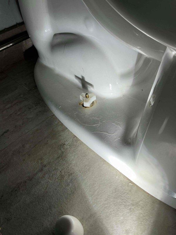 Responded to callback service for toilet not flushing properly after previous work. Removed metal washer from underneath the toilet base nuts to correct cap fitment issue, and adjusted water level in tank by raising it approximately 1/4 inch. Toilet now flushes as intended with properly seated bolt caps.