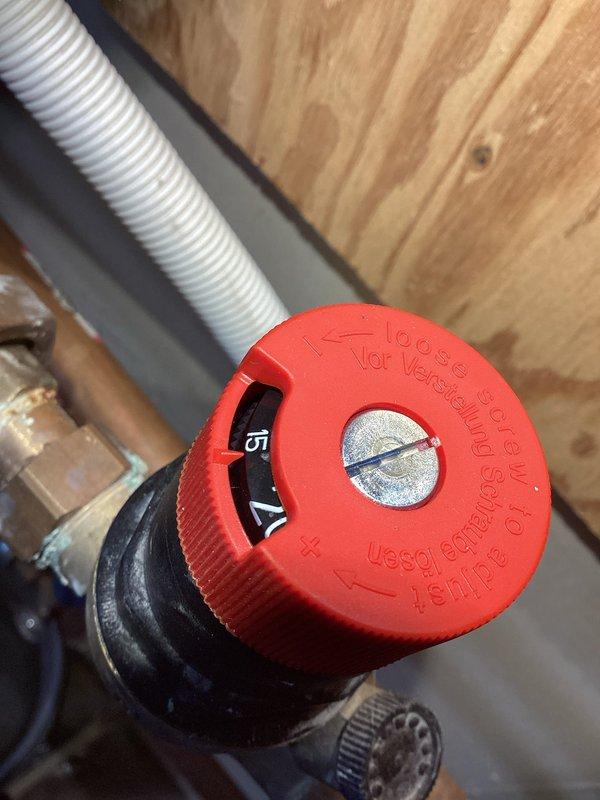 Responded to service call for in-floor heating system with reported leak filling bucket every two days. Upon inspection, identified backflow preventer as source of leak, successfully repaired the issue, and completed documentation for potential replacement if needed in future. System appears to be in good working order with no further leaks observed.