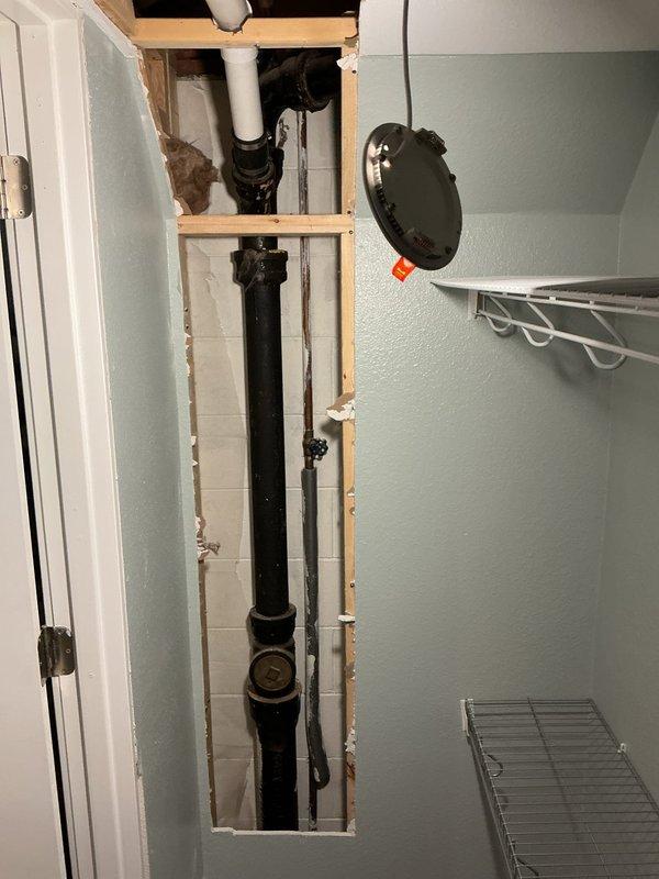 Successfully completed tub/shower drain line replacement after identifying compromised drain pipes. Opened wall access to replace failing metal drain pipes with new PVC components, including proper P-trap installation. Restored full drainage functionality, preventing future system failures in the affected bathroom area.