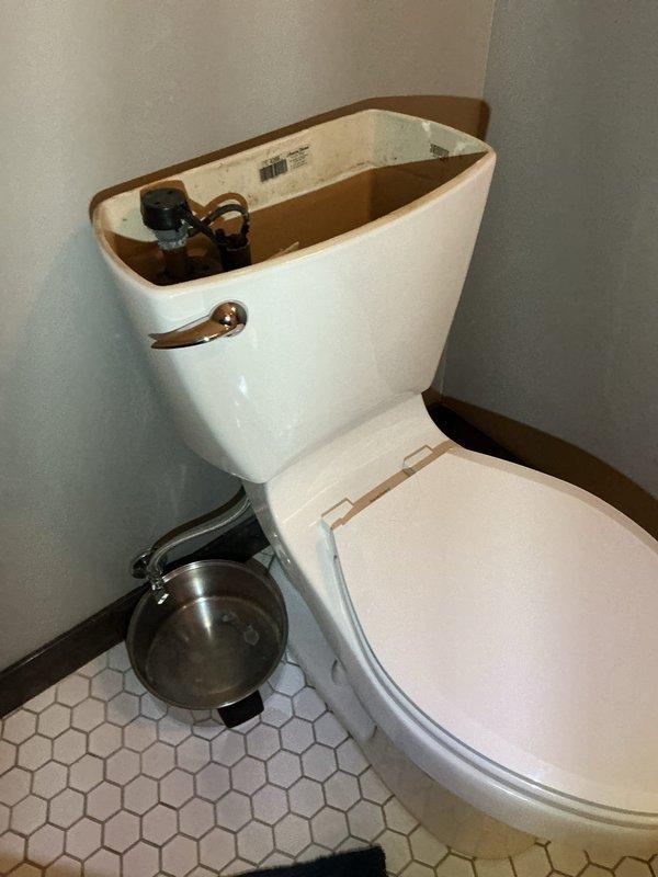 Identified and repaired toilet with leaks at spud connection and tank washers. Replaced spud assembly, installed new washers, and completed full toilet replacement as required to resolve issue.