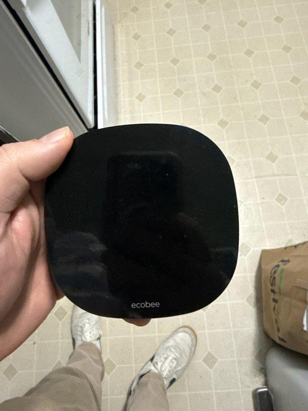 Responded to service call for non-functioning thermostat. Found Ecobee thermostat detached from wall with broken connection prongs. Installed new Honeywell T6 smart thermostat, properly wired all connections, and assisted customer with mobile app setup. System now properly controlling furnace operation.