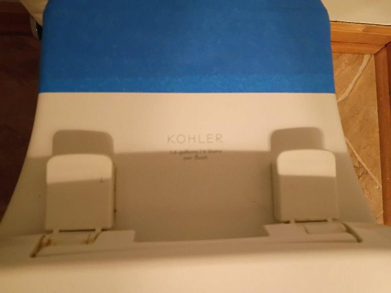 Replaced customer's broken elongated toilet tank with complete new Kohler toilet unit after assessment determined replacement was more practical than tank-only repair. Installed new toilet seat and lid assembly with proper mounting hardware, ensuring secure connection to the bowl. Verified proper function and no leaks before completing service.