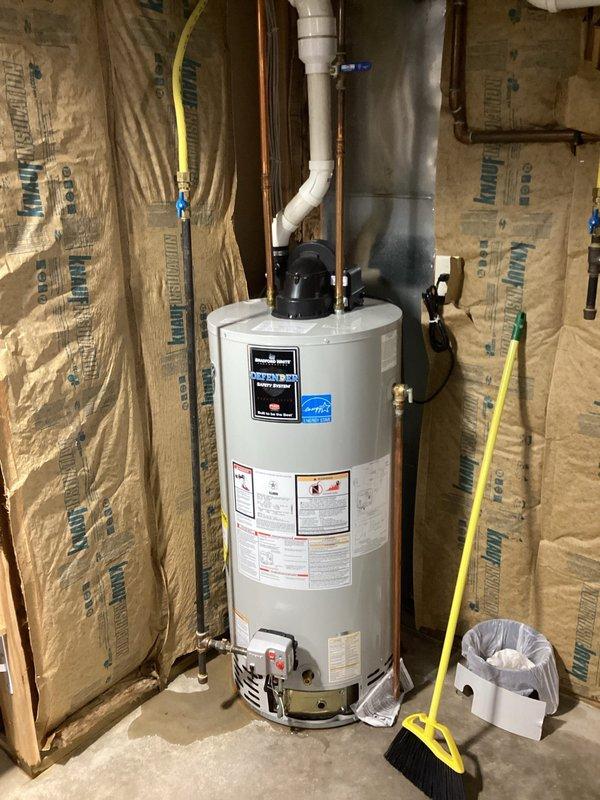 Responded to no hot water complaint and found existing Bradford White water heater leaking. Confirmed unit was under manufacturer's warranty and replaced with new 50-gallon natural gas power-vented water heater of same model and specifications. Completed installation with proper venting and connections, restoring hot water service to the residence.