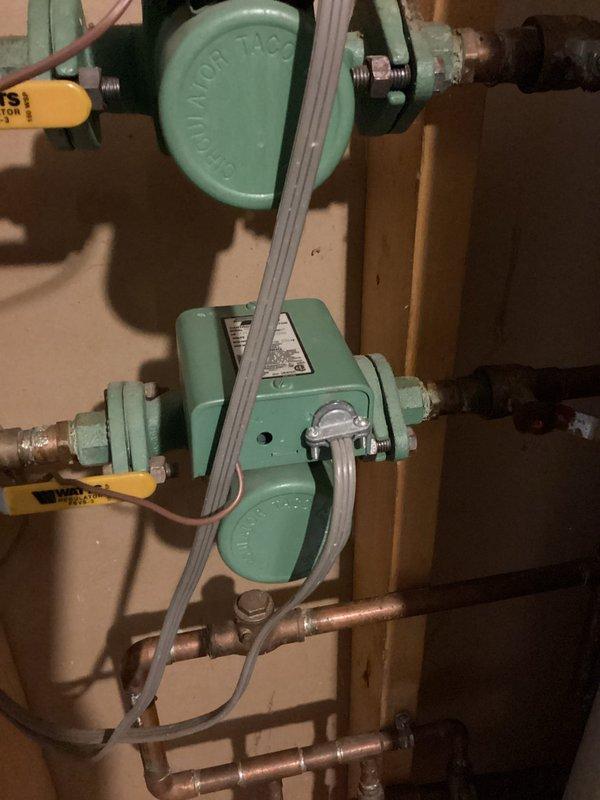 Responded to service call for geothermal heating system not running properly and making unusual noise. Upon inspection, determined unit required specialized geothermal expertise beyond current capabilities; however, identified and restored operation of a non-functioning in-floor heating loop circulator pump. System was operational upon departure, but scheduled follow-up service with geothermal specialist for comprehensive diagnosis.