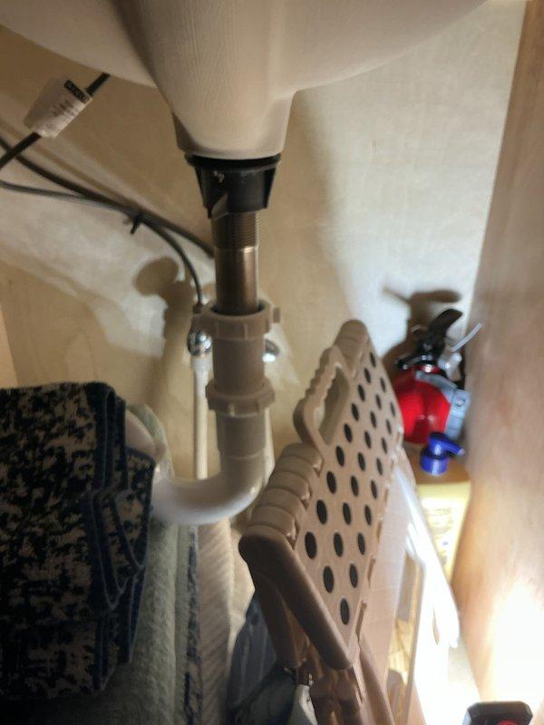 Conducted annual plumbing inspection on recently constructed home (built approximately four months ago). All plumbing systems and fixtures, including bathroom sink with Nantucket basin and matte black faucet, are in excellent working condition with properly installed P-trap drain assembly. Recommended future installation of water softener system for optimal long-term plumbing performance.