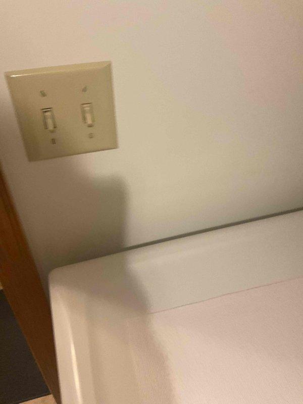 Diagnosed bathroom ventilation issues and found flapper stuck open due to dust accumulation. Removed debris causing obstruction, allowing flapper to close properly. Replaced aging exhaust fan unit to ensure proper ventilation and prevent future condensation issues.