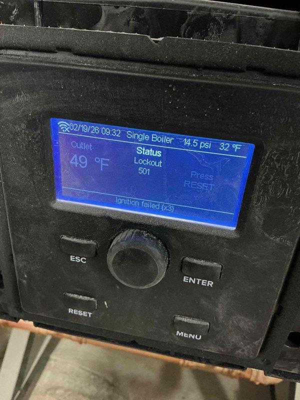 Responded to service call for boiler lockout (error code 501) with ignition failure (code 63). Diagnosed issue as dust accumulation on igniter and flame sensor in construction environment affecting ignition sequence. Performed cleaning of components as temporary solution to restore heat functionality.