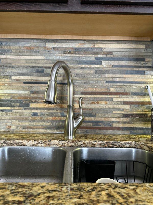 Responded to service call for kitchen faucet issues. Diagnosed low water pressure and constant leaking caused by improper installation of previous fixture. Removed existing faucet and installed new kitchen faucet, ensuring proper connections to supply lines. Tested for appropriate water pressure and confirmed no leaks present after installation.