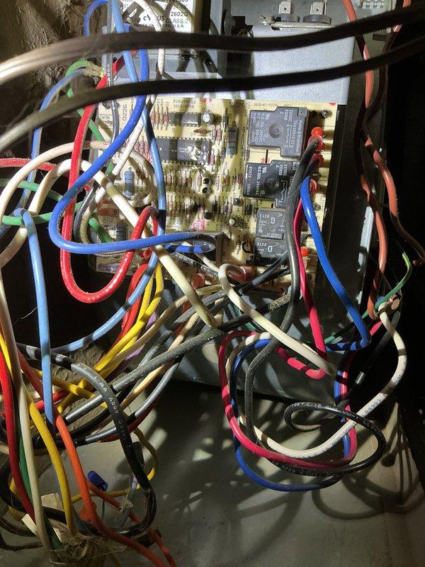 Diagnosed and resolved no heat issue on 23-year-old Goodman 80% furnace. Inspection revealed draft motor was sticking, causing pressure switch failure and system shutdown. Replaced draft motor, which restored proper system operation and heat function. Visual inspection also noted dust accumulation on blower wheel and discoloration on control board that may require future attention.