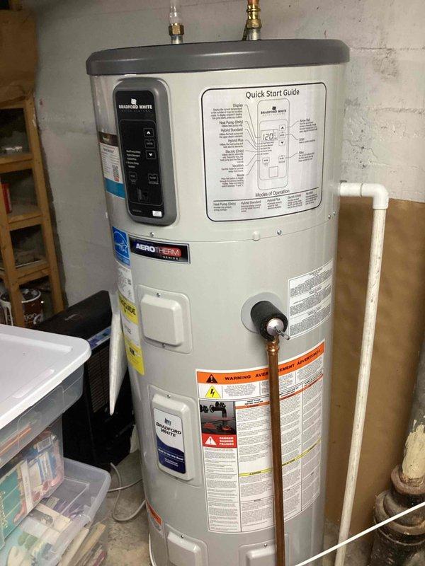 Responded to service call for non-functional garbage disposal that was powering on but humming without blade movement. Used disposal wrench to attempt manual rotation, but determined unit was beyond repair. Installed new 1/2 horsepower garbage disposal to replace failed unit.