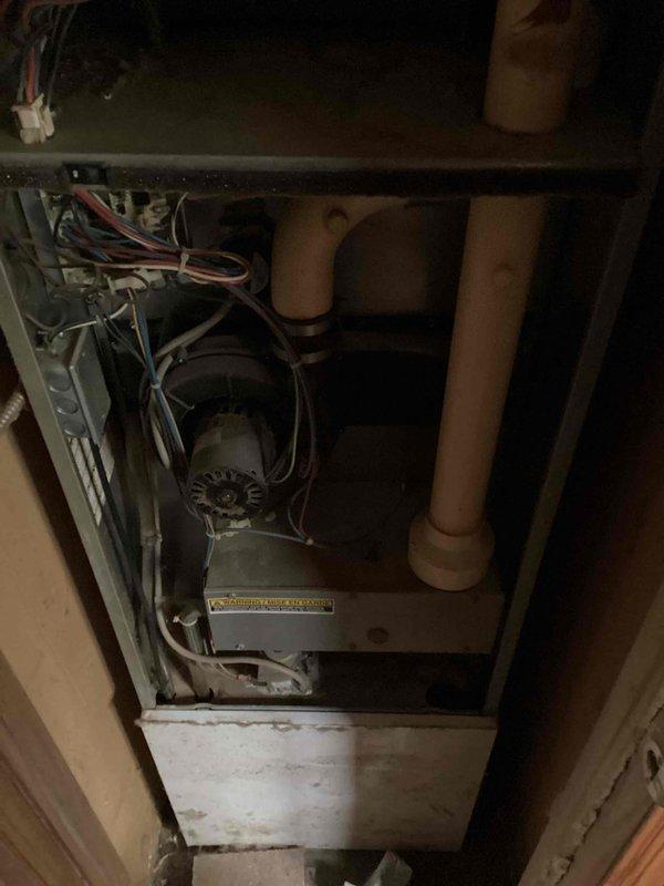 Serviced 2009 LP furnace with no heat complaint where blower motor was continuously running regardless of thermostat position. Diagnosed ignition failure code caused by tripped limit switch in inducer motor. Discovered severely rusted burners and secondary heat exchanger clogged with debris causing significant airflow restriction, which likely triggered the limit switch due to overheating. Reset system and restored temporary operation pending scheduled replacement of burners and cleaning of secondary heat exchanger.