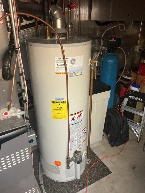 Replaced leaking plastic connector on refrigerator water supply line under kitchen sink with copper piping and new shut-off valves. Verified proper operation with no leaks after installation.