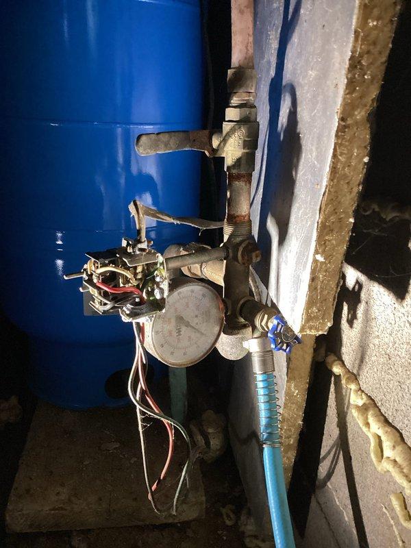 Responded to service call for water pressure issues and hot water concerns. Diagnosed and replaced faulty pressure switch on recently installed pressure tank, resolving delayed water flow problem. Inspected water heater and found no error codes present; system was producing adequate hot water during service visit.