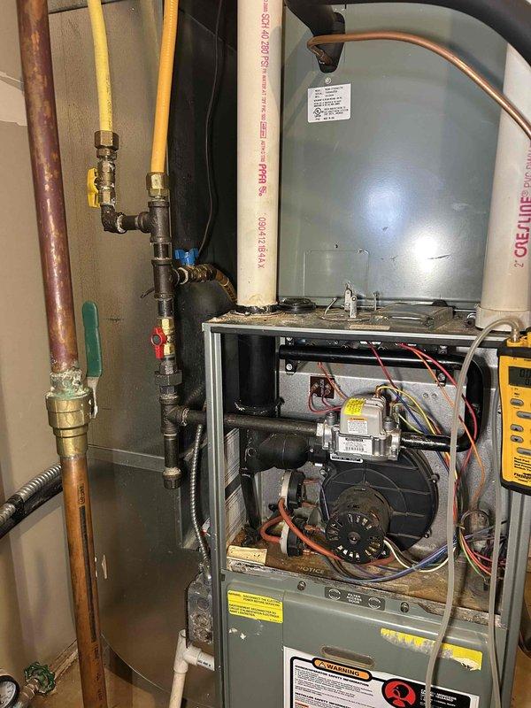 Responded to commercial furnace failure where unit was cycling off after 30 seconds of operation with blower running but no heat production. Diagnosed failed gas valve as root cause. Due to absence of service shutoff, temporarily disconnected gas to entire building to safely replace defective valve. Installed new gas valve with proper service shutoff, adjusted gas pressure to manufacturer specifications, and verified proper system operation through complete testing.