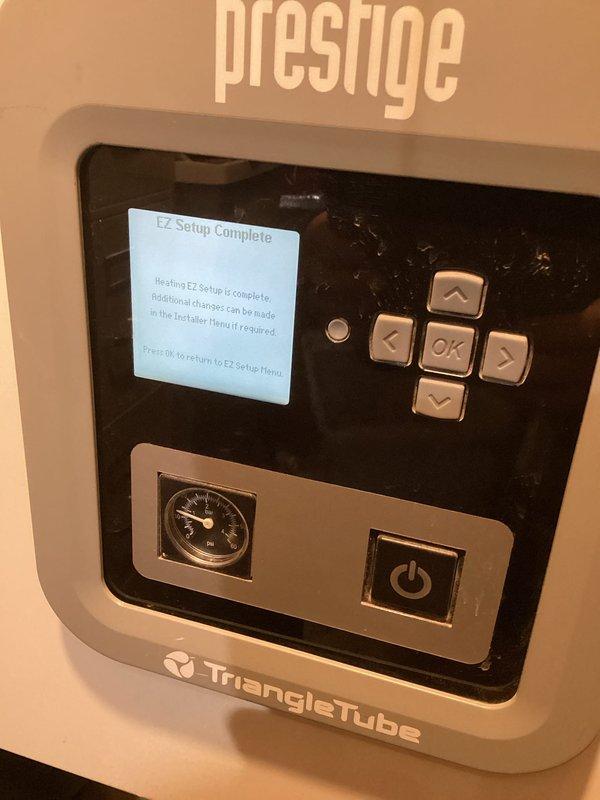 Responded to service call for non-functioning 13-year-old boiler displaying lockout due to failed ignition. Inspection revealed a pitted ignitor with significant wear. Reset unit and successfully restored operation, verifying proper system circulation. Recommended replacement of the ignitor to prevent future failures.