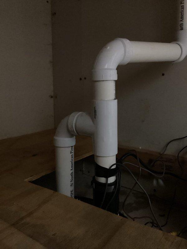 Responded to service recall for persistent sump pump alarm. Diagnosed water accumulation in the collection basin and replaced 10-year-old pump that was malfunctioning despite troubleshooting attempts. Installed new sump pump system with proper PVC drainage configuration to resolve the continuous alarm issue.