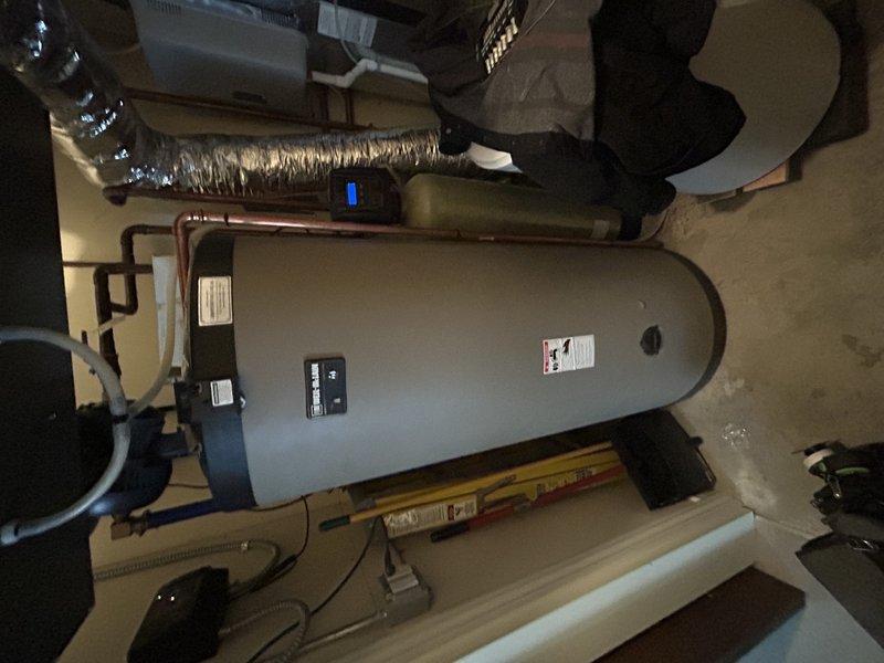 Completed boiler maintenance service which included replacing the hot surface ignitor, thoroughly cleaning the heat exchanger to remove significant green scale buildup, and performing a comprehensive boiler tune-up. System testing confirmed proper operation for both floor heating and domestic hot water functions after service completion.