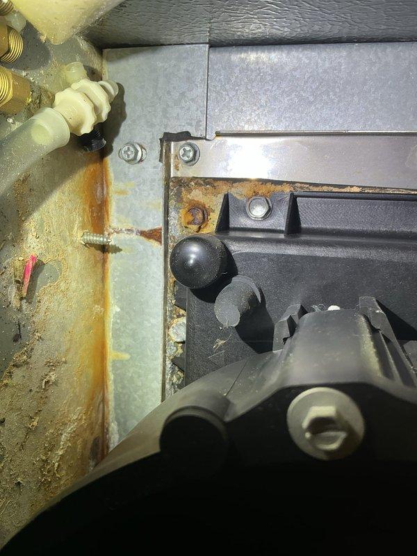 Responded to no heat complaint on 12-year-old Goodman gas furnace that was blowing cool air. Diagnostic testing revealed system tripping on flame sensor failure. Noted previous collector box leakage and visible corrosion on metal components. Performed comprehensive system check and replaced defective flame sensor to restore proper heating function.